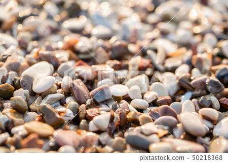 Close up beach stones on the seashore. Summer sunrise on coast, Corfu island, Greece. Beach Ionian Close up beach stones on the seashore. Summer sunrise on coast, Corfu island, Greece. Beach Ionian 50218368