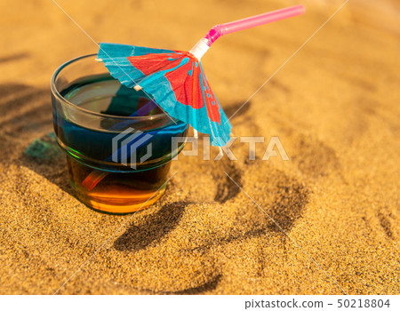 colorful shots drinks on a sandy beach colorful shots drinks on a sandy beach 50218804