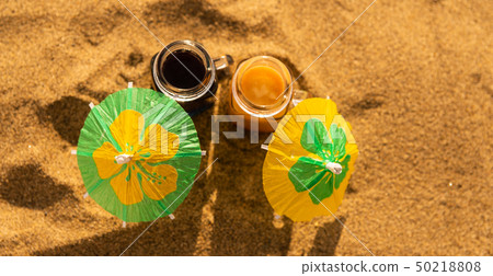 colorful shots drinks on a sandy beach colorful shots drinks on a sandy beach 50218808