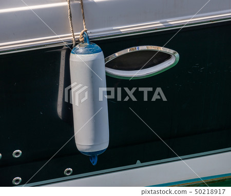 buoy hanging outside the hull of the boat buoy hanging outside the hull of the boat 50218917