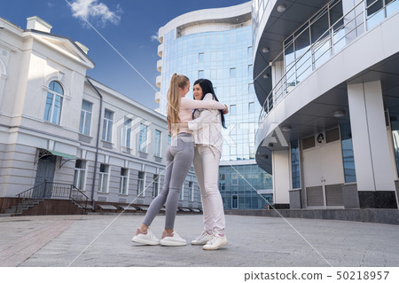 Portrait of two embracing women 50218957
