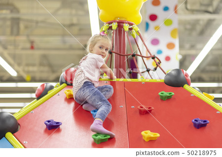 child on mountain top in the playground 50218975