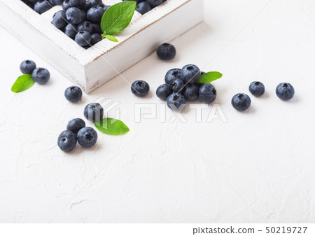 Fresh raw organic blueberries with leaf in vintage 50219727
