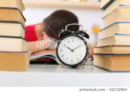 Tired female student at workplace Tired female student at workplace 50219964