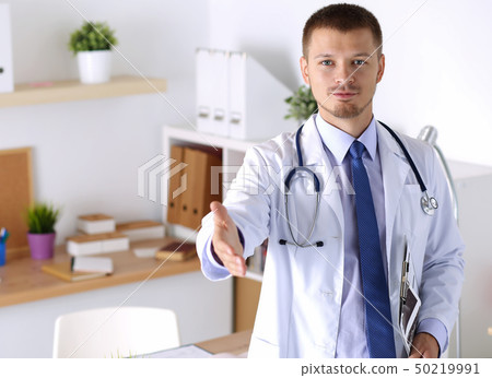 Physician ready to examine patient Physician ready to examine patient 50219991