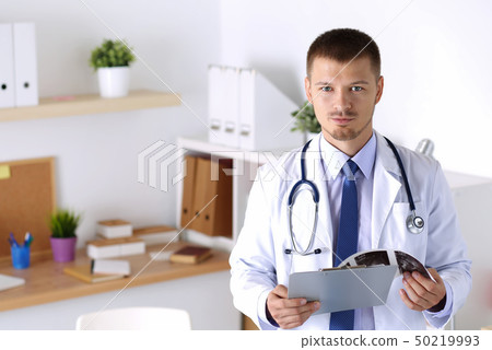Physician waiting for patient Physician waiting for patient 50219993
