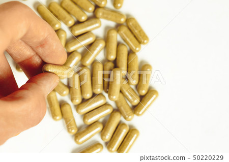 hand holding medication hand holding medication 50220229