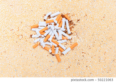 Pile cigarettes broken on table terrazzo flooring Pile cigarettes broken on table terrazzo flooring 50221063