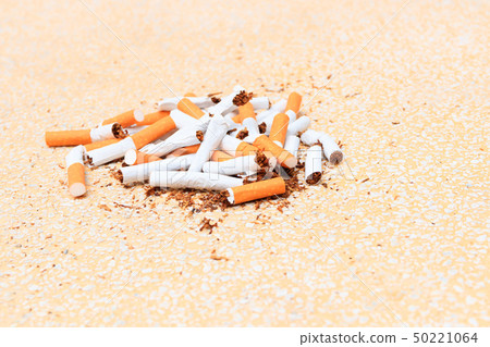 Pile cigarettes broken on table terrazzo flooring Pile cigarettes broken on table terrazzo flooring 50221064