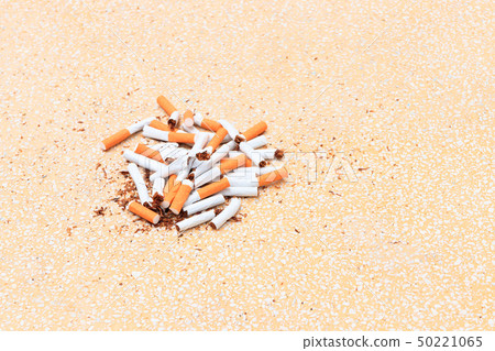 Pile cigarettes broken on table terrazzo flooring Pile cigarettes broken on table terrazzo flooring 50221065