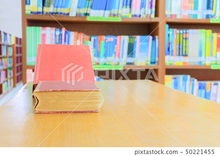 old book red and heap treatise in school library 50221455