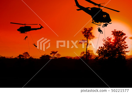 Silhouette Soldiers rappel down to attack Silhouette Soldiers rappel down to attack 50221577