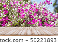 Empty wooden tabletop with flower backgroud 50221893