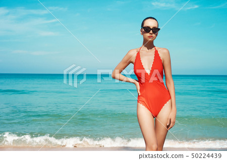 Sexy woman in beautiful sunglasses and red 50224439