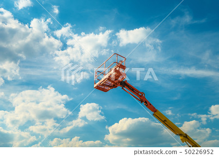 Cherry picker on the blue sky background Cherry picker on the blue sky background 50226952