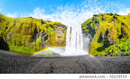 Skogafoss - one of the most beautiful waterfalls on sunny day with rainbow, Skogar, Iceland Skogafoss - one of the most beautiful waterfalls on sunny day with rainbow, Skogar, Iceland 50229554