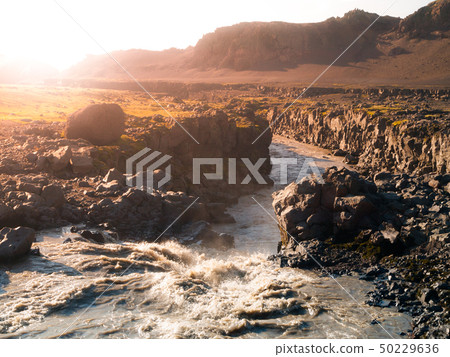 Wild icelandic river full of muddy water Wild icelandic river full of muddy water 50229636