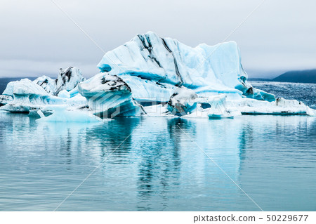 Blue icebergs in Jokulsarlon Glacier Lagoon, Iceland Blue icebergs in Jokulsarlon Glacier Lagoon, Iceland 50229677