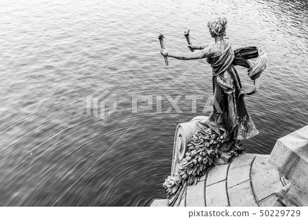 Torch bearer woman figure - bronze decoration of Svatopluk Cech Bridge over Vltava River in Prague Torch bearer woman figure - bronze decoration of Svatopluk Cech Bridge over Vltava River in Prague 50229729