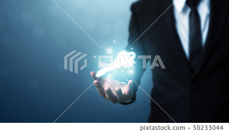 Businessman hand showing key to success 50233044