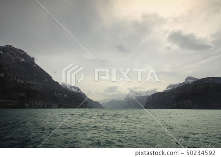 Winter lake cloudy mountain climate change flood 50234592