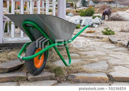 A hand cart with a wheel for garbage collection A hand cart with a wheel for garbage collection 50236859