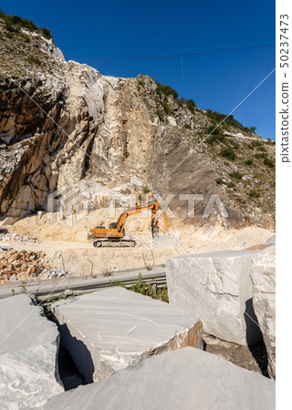 Italian marble quarry - Excavator with jackhammer 50237473