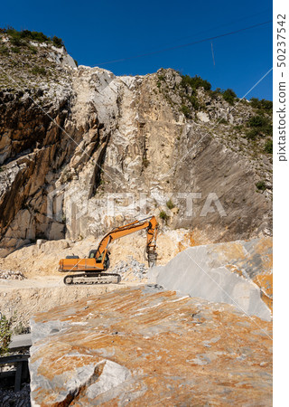 Italian marble quarry - Excavator with jackhammer 50237542