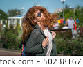 Wind waving red haired girl in sunglasses 50238167