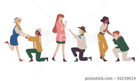 Couples in love, men makes marriage proposal to the women kneeling 50239019