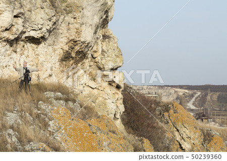 The photographer is doing a landscape shooting. The photographer is doing a landscape shooting. 50239360