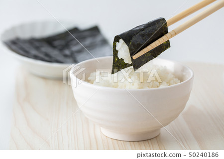 Japanese rice Japanese food eating seaweed wrapped in white rice on white background Japanese rice Japanese food eating seaweed wrapped in white rice on white background 50240186