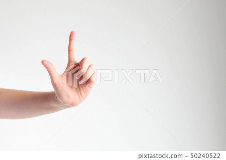 Hand raising the forefinger to touching something. Hand raising the forefinger to touching something. 50240522