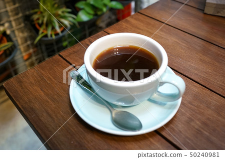 Black coffee on wooden table Black coffee on wooden table 50240981