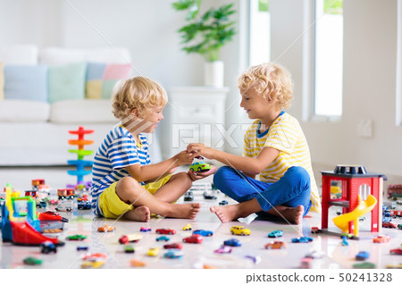 Kids play with toy cars. Children playing car toys 50241328