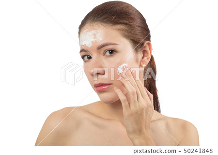 girl applying cream 50241848
