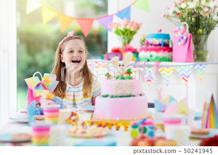 Kids birthday party. Child with cake and presents. Kids birthday party. Child with cake and presents. 50241945