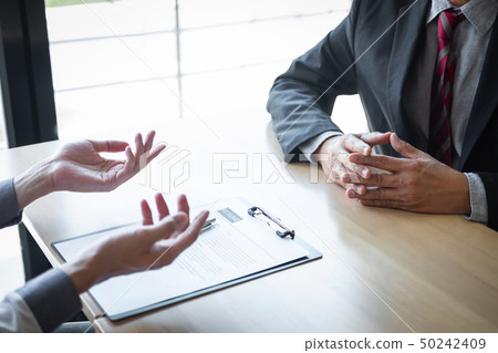 Employer arriving for a job interview, businessman 50242409