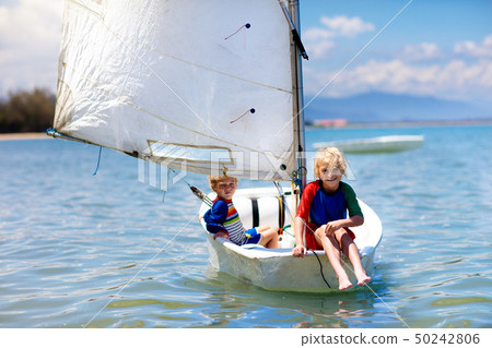 Child sailing. Kid learning to sail on sea yacht. Child sailing. Kid learning to sail on sea yacht. 50242806
