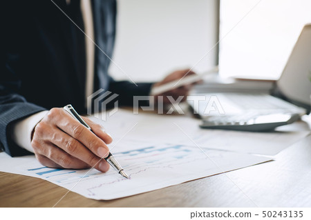 Businessman working new project on laptop computer 50243135