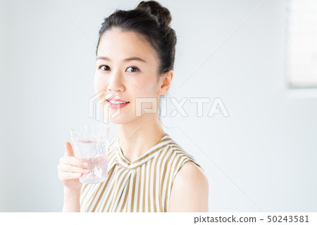 Young woman (mineral water) Young woman (mineral water) 50243581