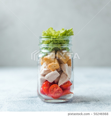 Caesar salad in glass mason jar, copy space Caesar salad in glass mason jar, copy space 50246988