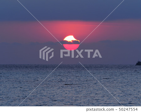 Partial Solar Eclipse Rising from the Sea / Partial Solar Eclipse over sea Partial Solar Eclipse Rising from the Sea / Partial Solar Eclipse over sea 50247554