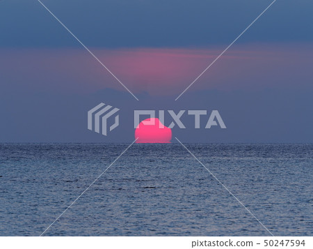 Partial Solar Eclipse rising over the ocean 50247594