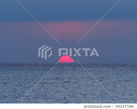Partial Solar Eclipse Rising from the Sea / Partial Solar Eclipse over sea 50247596