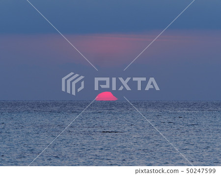 Partial Solar Eclipse Rising from the Sea / Partial Solar Eclipse over sea 50247599