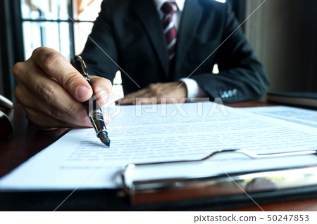 Lawyer working on the table in office. 50247853