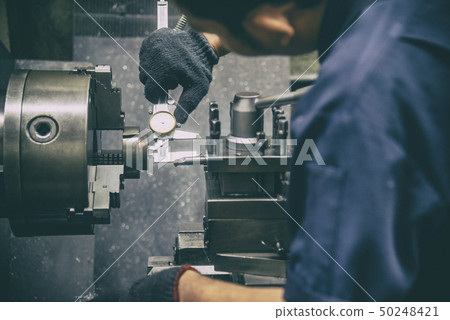 The lathe machine operator  50248421