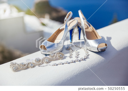 White wedding shoes and jewelry 50250555