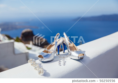 White wedding shoes and jewelry White wedding shoes and jewelry 50250556